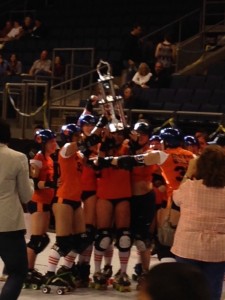 Orange Crushers hoist trophy